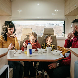 LR Motorhome – 4 Berth-family-eating-inside